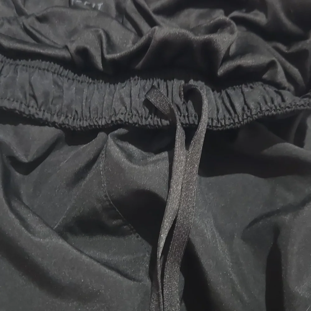 Nike Dri-Fit black lined women's shorts draw-string size medium